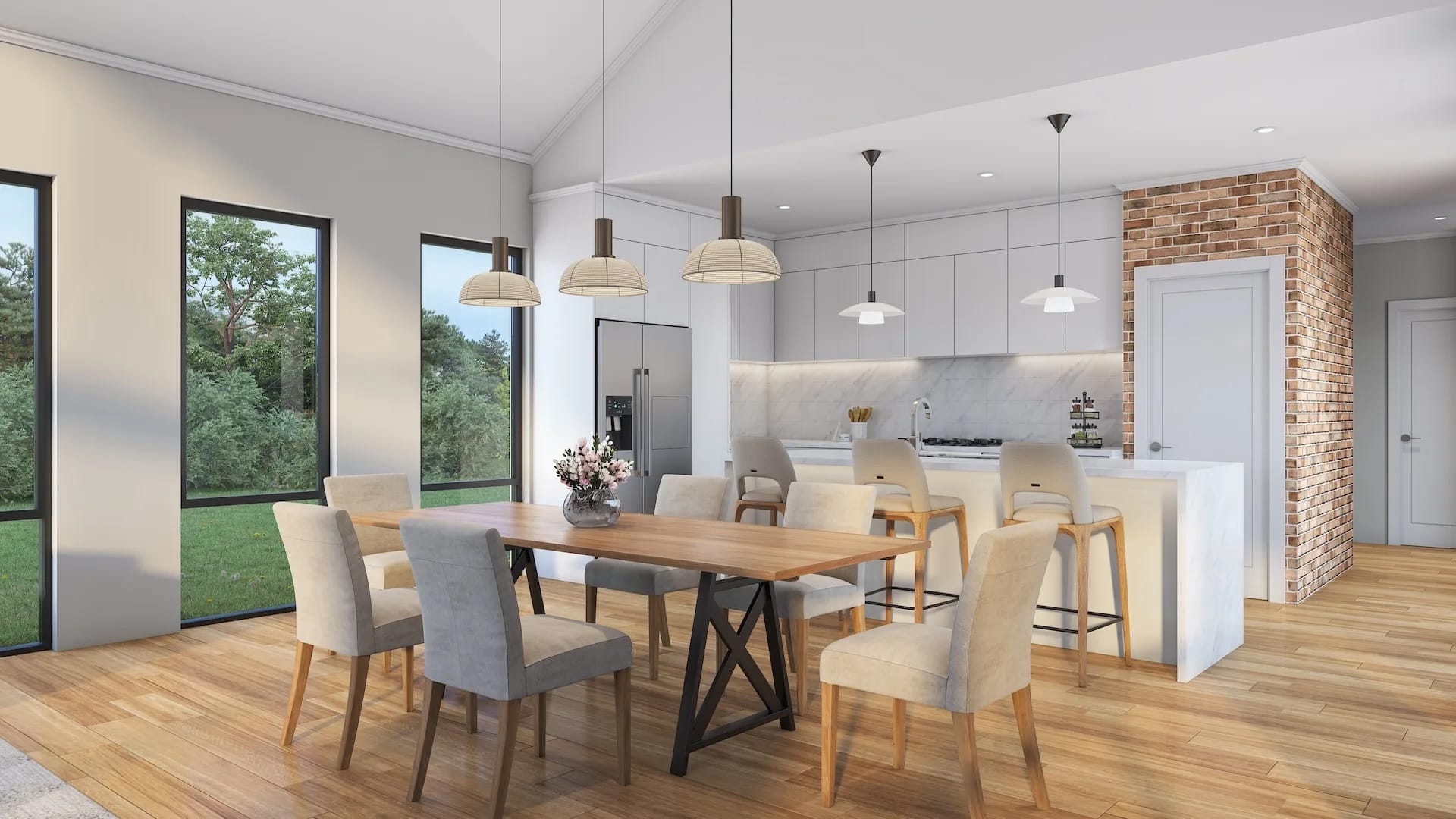 Open-plan kitchen and dining area in the North Dandalup project with timber flooring, a stone-topped kitchen island, feature brickwork, and pendant lighting.
